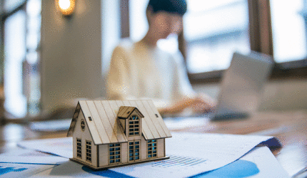 small model of a home on a tabletop